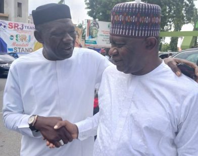 Kogi State Commissioner for Solid Minerals and Natural Resources, Engr. Abubakar Bashir Gegu (L) and Senator Representing Kogi West Senatorial District, Sunday Steve Karimi
