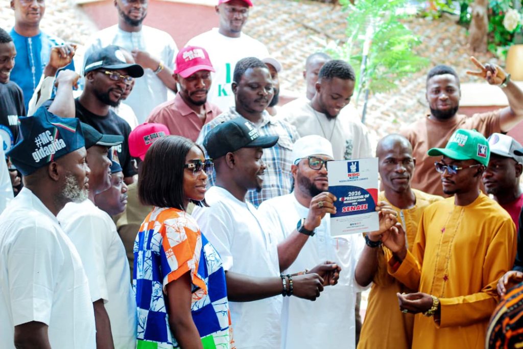 FCT NDC senatorial aspirant Hon Ezikel Musa Dalhatu display his nomination forms purchased for him by the FCT youths.
