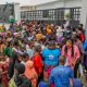 Beneficiaries receive free food during the APC Youth Network West Africa weekly outreach programme at Agidingbi, Ikeja, Lagos.