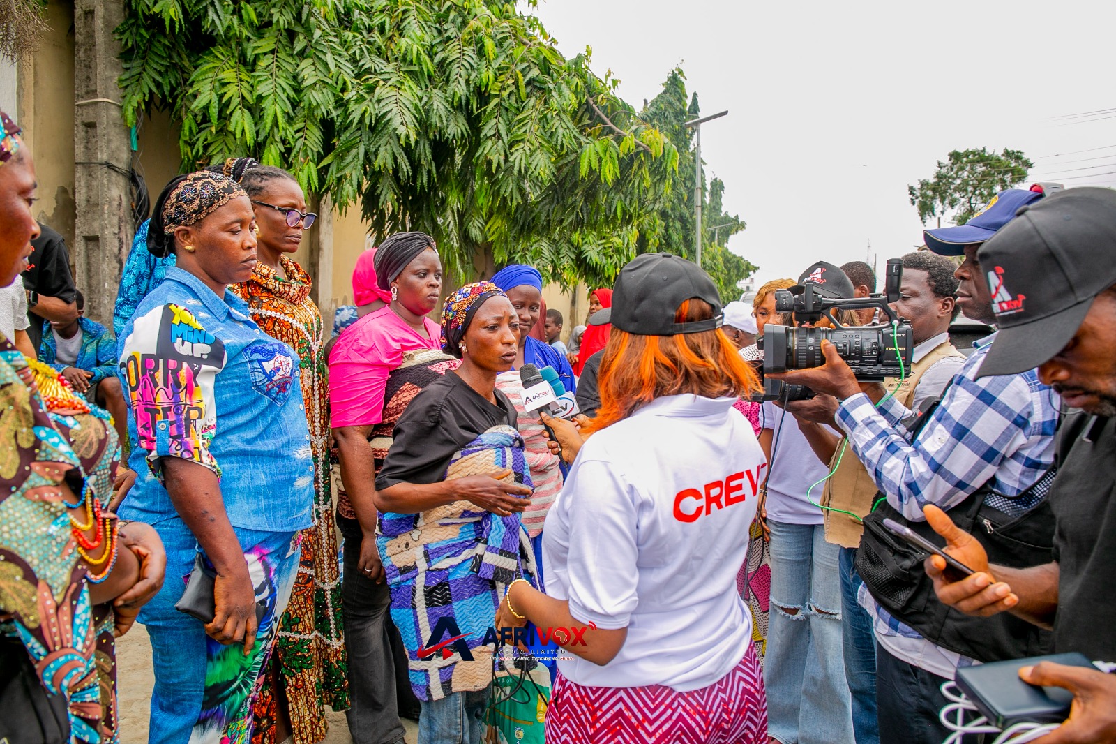 Beneficiaries receiving meals during APCYN-WA's weekly humanitarian outreach in Lagos.
