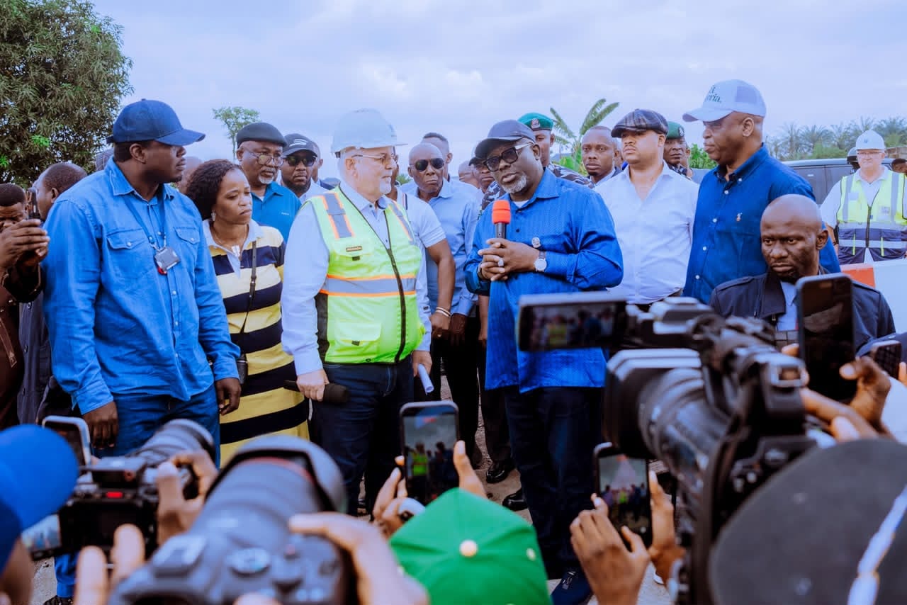 Julius Berger officials assess the washed-out Agbarho section of the East-West Road as plans for permanent rehabilitation get underway.